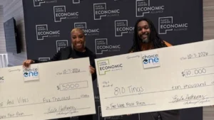 Flint small business owners pose after winning prize money in the Two-Lane Fast Pitch competition