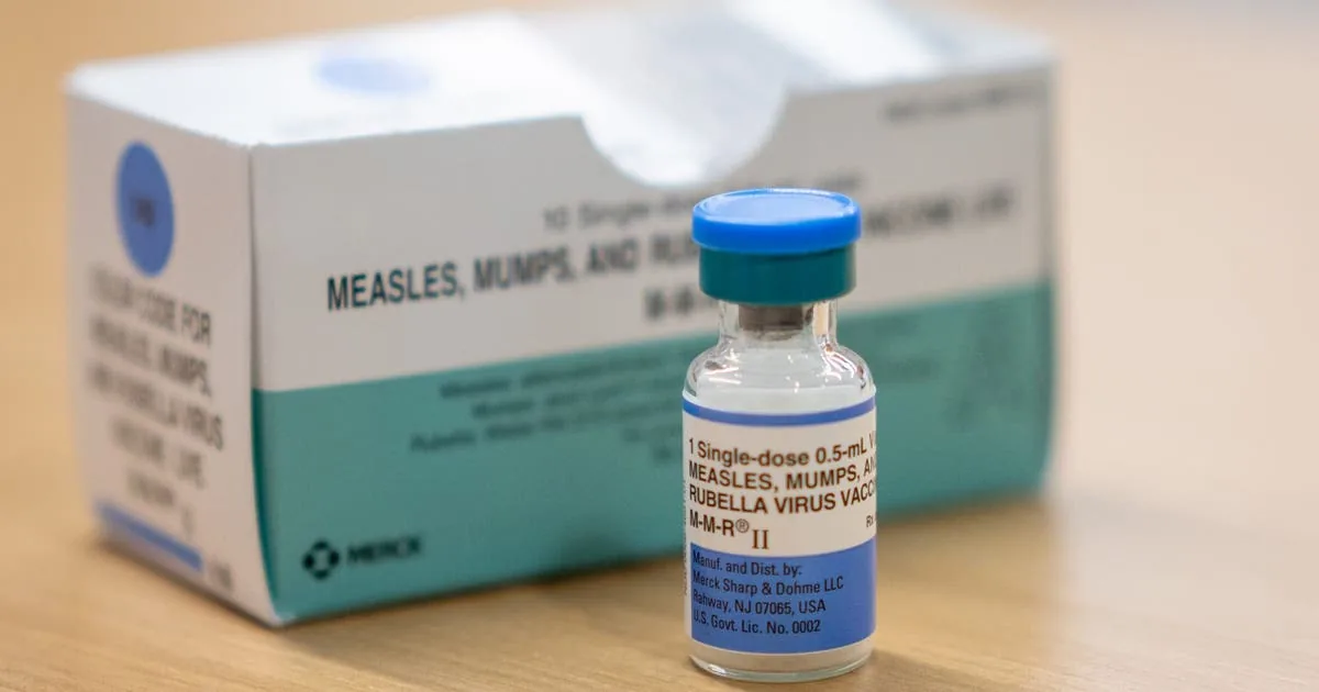 A measles vaccine clinic with boxes and vials of MMR vaccine